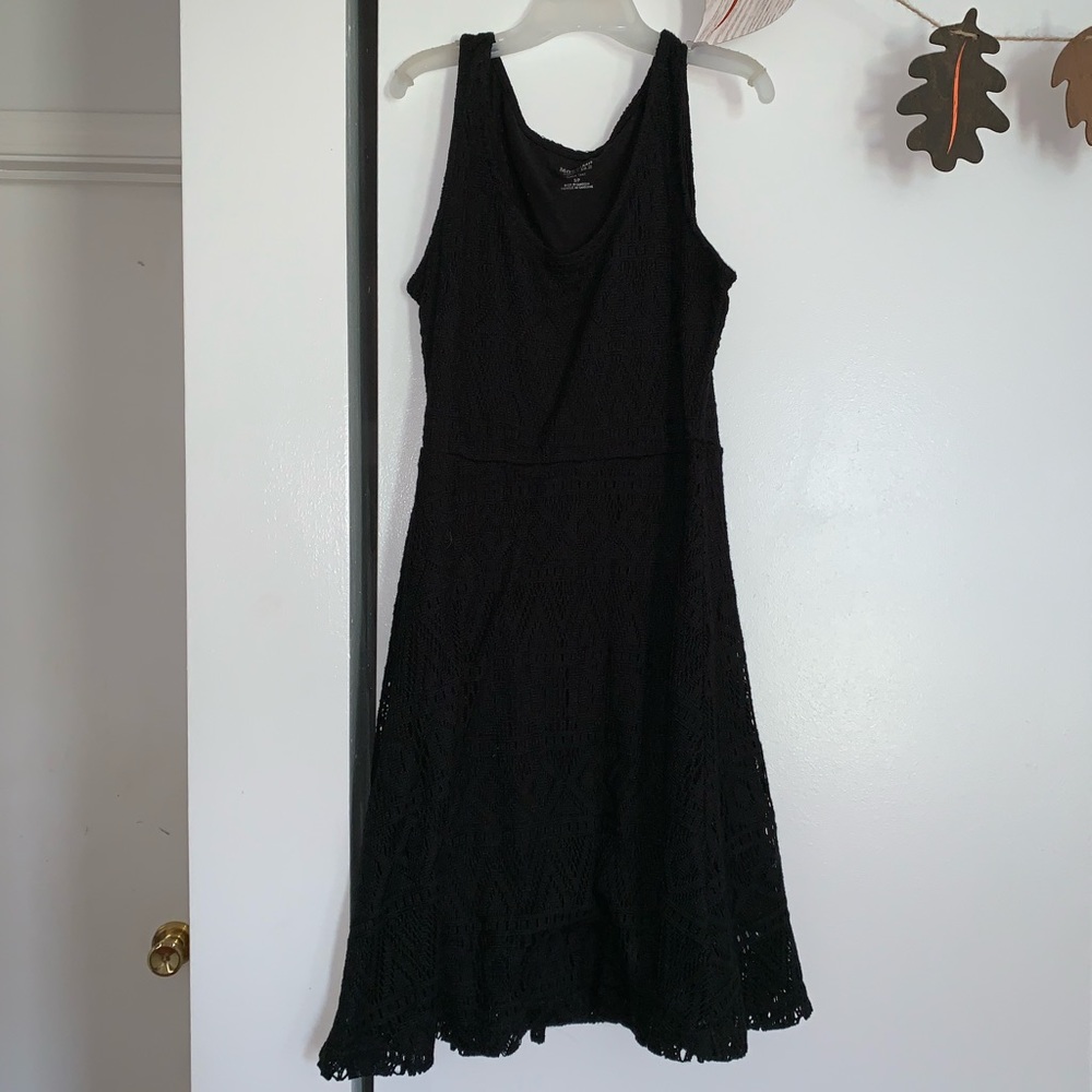 Black, sleeveless patterned dress